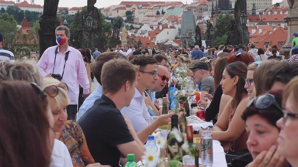 In Prague, thousands put protection away, feast ‘farewell’ to coronavirus