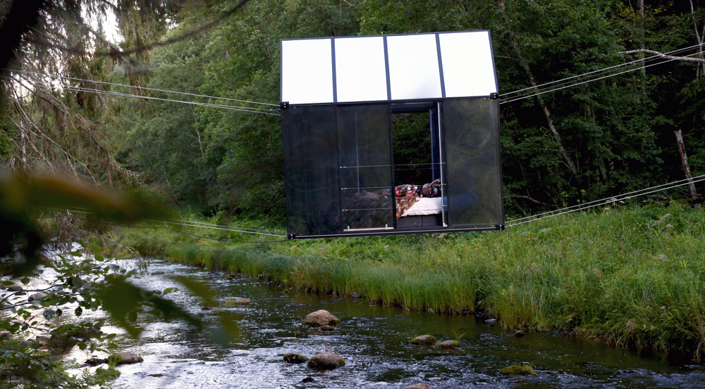 Latvia lures tourists with mirror house hanging over river