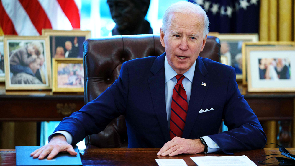 Biden signs bill raising US debt limit, averting default