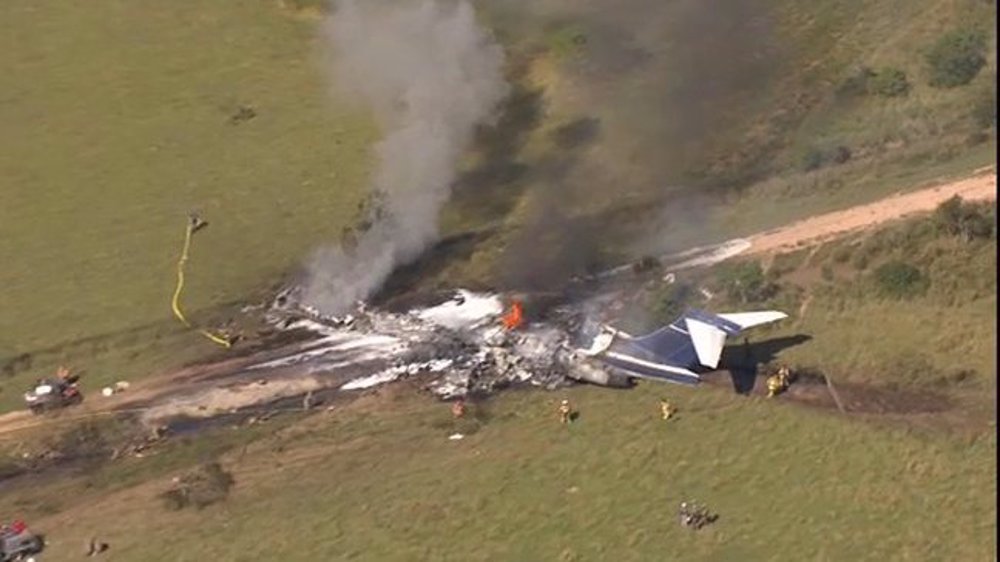 US plane with 21 people onboard crashes in Houston