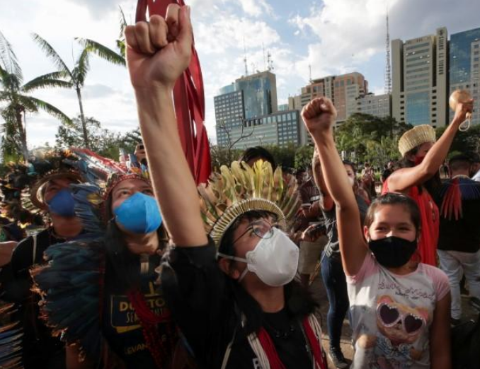 Hundreds of indigenous Brazilians protest bill curtailing land rights