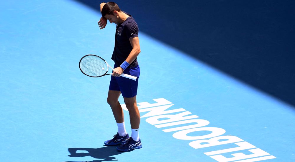 Djokovic back at Melbourne Park for practice session, visa still in doubt