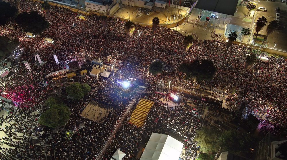 Tens of thousands march in Tel Aviv to voice anger against Netanyahu