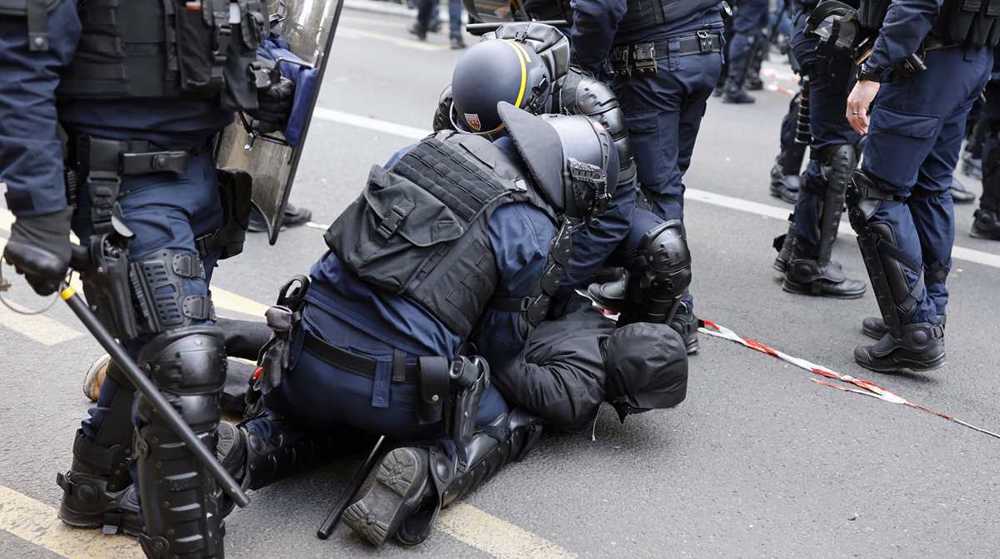 French police attack protesters as nationwide rallies rage against Macron