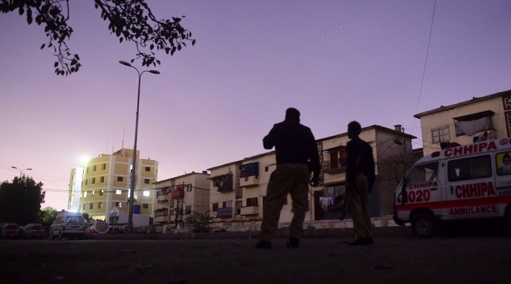 At least seven killed as militants storm Karachi police station