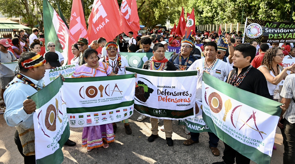 Indigenous people march in Belem as the Amazon Summit kicks off