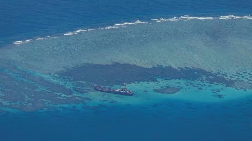 China says Philippine vessel ‘illegally’ entered disputed atoll