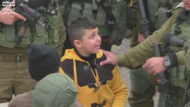 Israel troops grill terrified Palestinian kid: Video