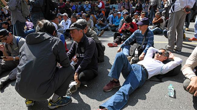 Taiwan police, protesters clash over pension cuts