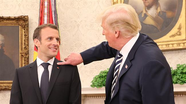 Trump brushes 'dandruff' off Macron's shoulder