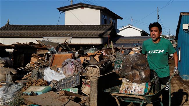 Japan’s PM visits disaster zone, promises help 