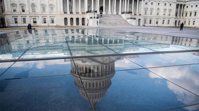 US House votes to avert shutdown as deadline looms
