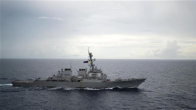 Chinese military warns US warship to leave South China Sea  