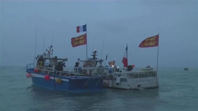 French flotilla stages protest off island in fishing row with UK