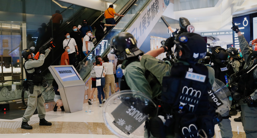 Protesters clash with police in Hong Kong mall amid virus restrictions 