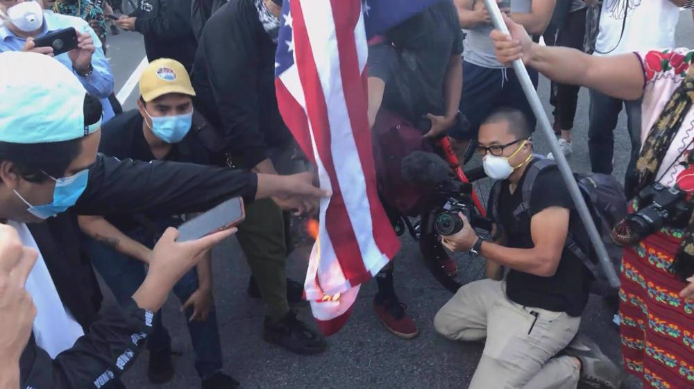 LA protesters burn US flag over police killing of black man 