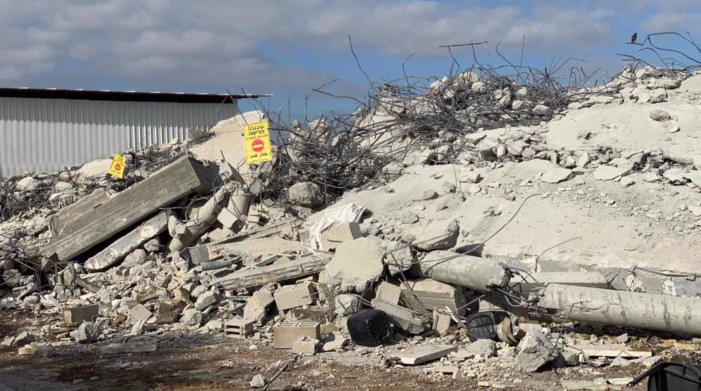 Israeli forces storm neighborhood in Tira, demolish Palestinian homes