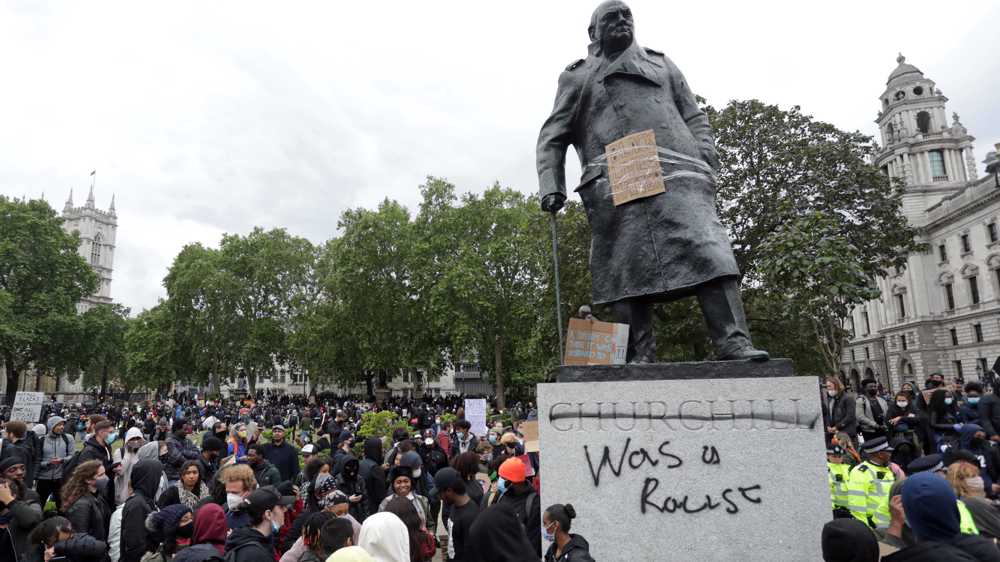 Churchill statue graffitied as Londoners protest