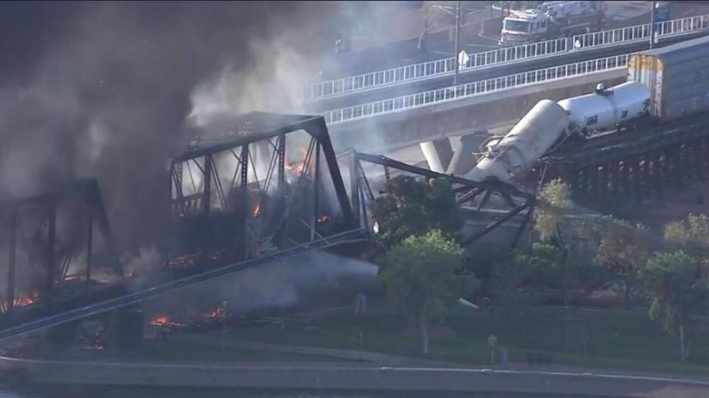  US bridge burns, partially collapses over train derailment