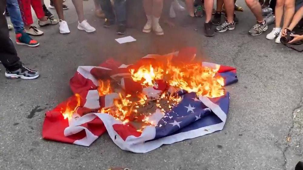 Protesters burn US flag outside White House after Trump's address