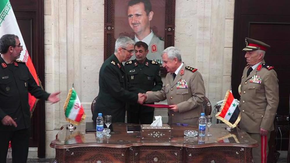 Iran's top cmdr., Syria's defense minister sign agreement to boost military, security cooperation
