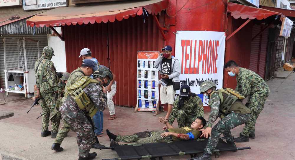 Twin bombings kill 15 in southern Philippines 
