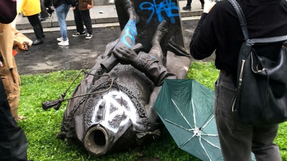 Statue of Canada's first prime minister toppled by protesters