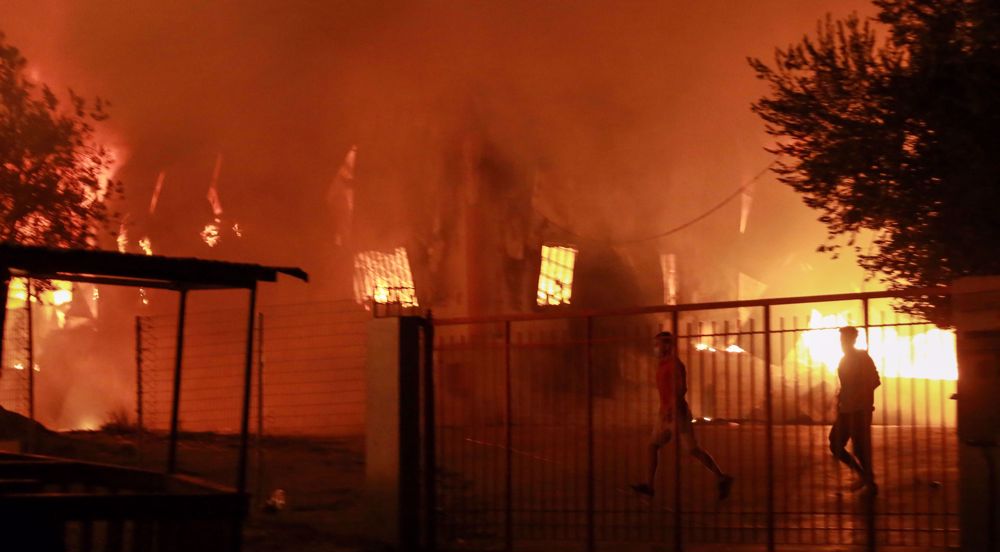 Fire breaks out at Greece refugee camp, forcing thousands to flee