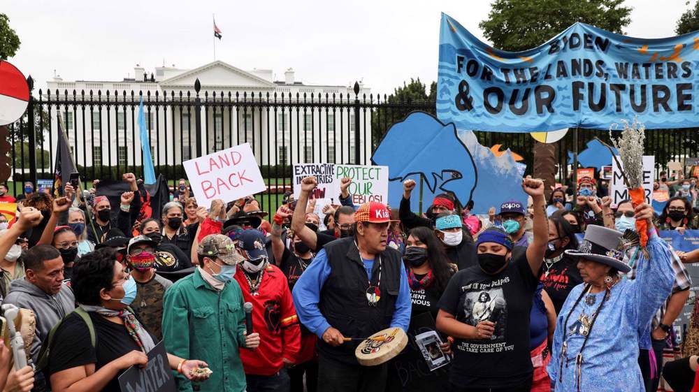 Climate protesters gather at White House, warn Biden