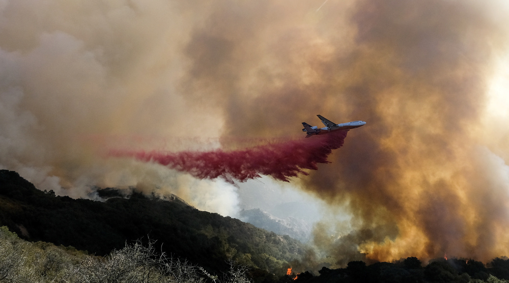 Wildfire engulfs vast area in California as firefighters struggle to contain it