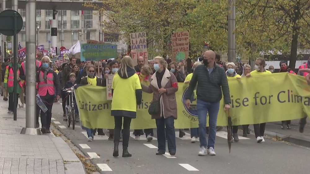 Protesters march in Brussels to pressure COP26 leaders over climate