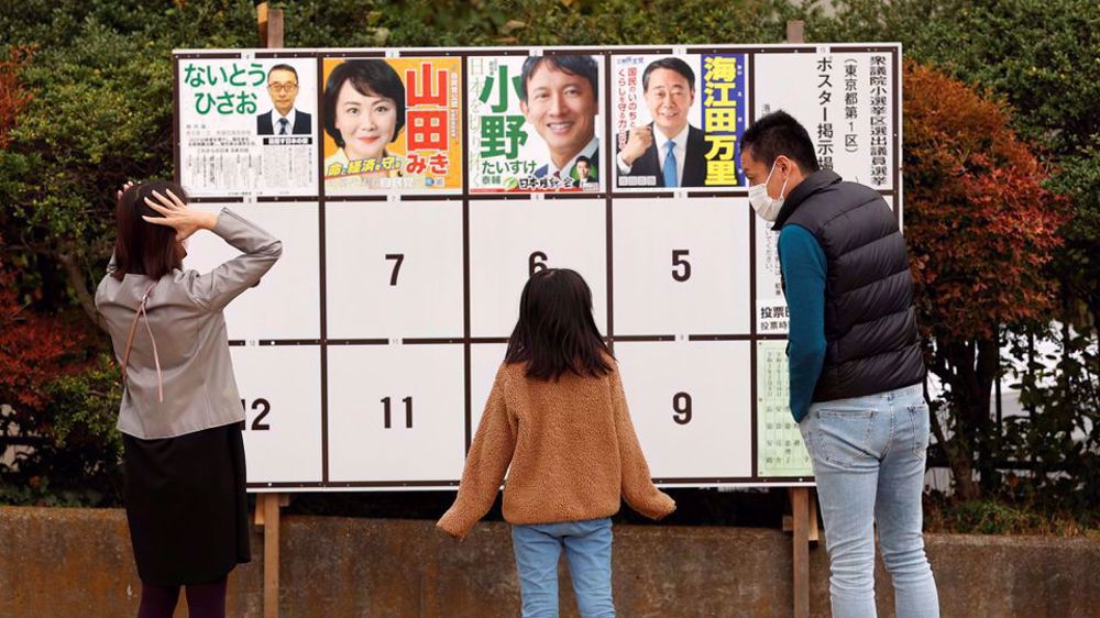 Japan's PM hangs on to majority in parliamentary election despite losses