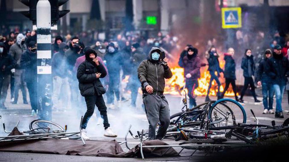 Rioters torch cars in Rotterdam in protest over new COVID-19 restrictions