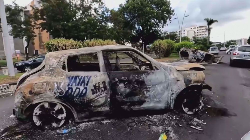 Burned cars, buildings in the aftermath of COVID-19 unrest in Guadeloupe