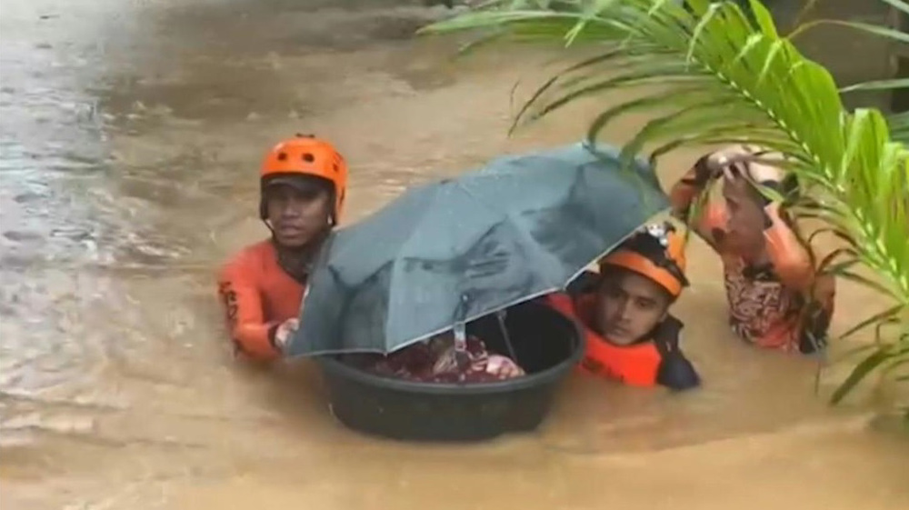 Baby floated to safety in tub as typhoon triggers floods in Philippines