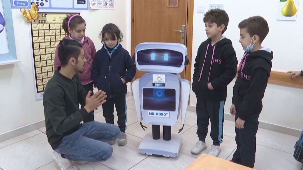 Palestinian-made robot interacts with students at Gaza school