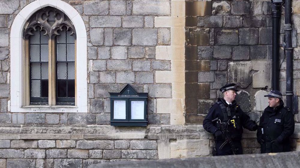 UK police arrest armed man on grounds of Queen's home