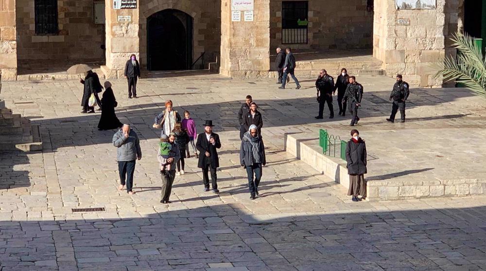 Scores of Israeli settlers storm al-Aqsa Mosque under military protection
