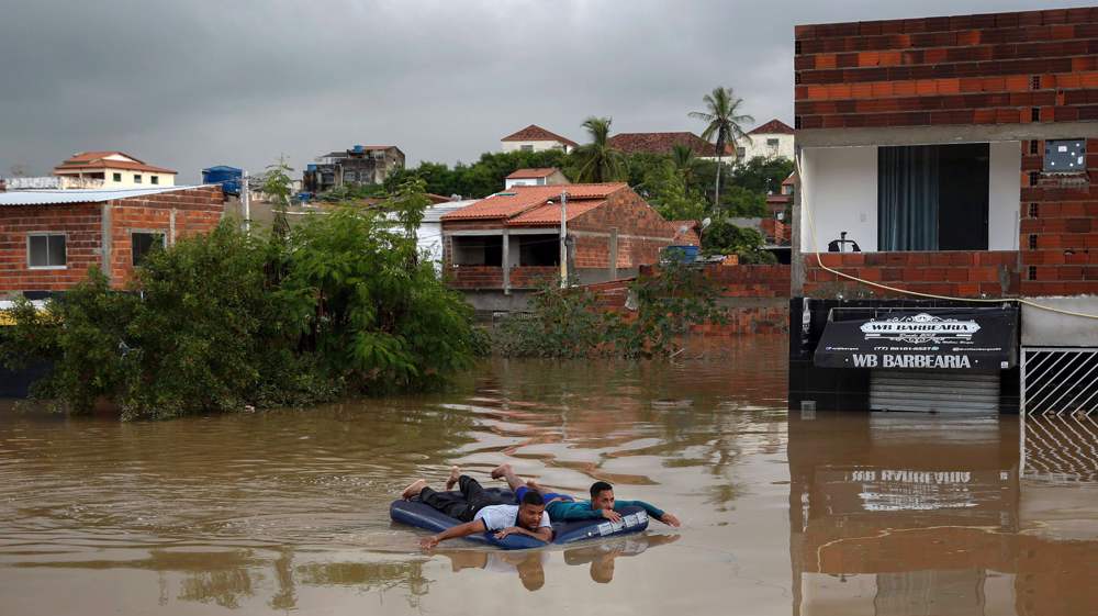 Death toll from Brazil flooding rises to 20 with streets turned to rivers