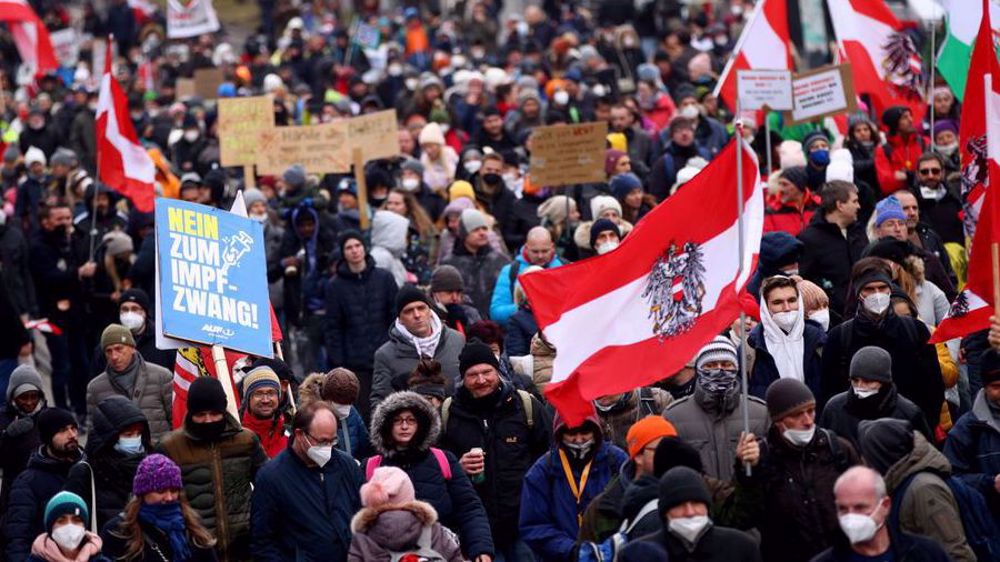Thousands march against COVID restrictions in northwest Europe