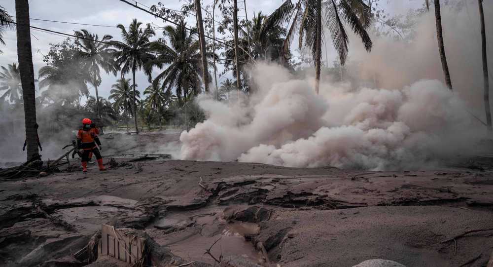Indonesian villagers search for missing relatives after volcano eruption