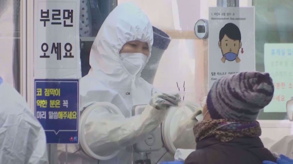 South Koreans face off over vaccine pass