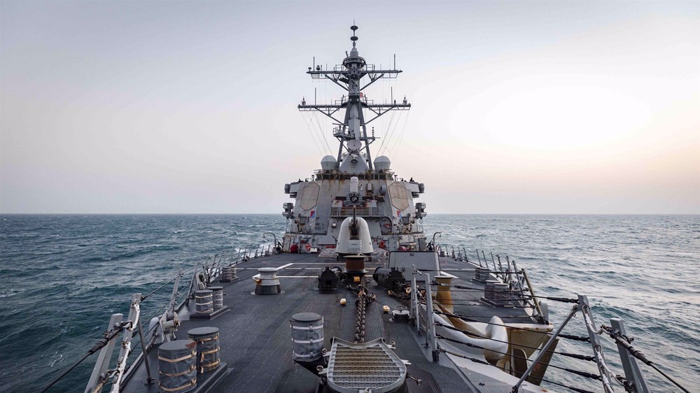 China blasts US 'old trick' as first warship sails under Biden