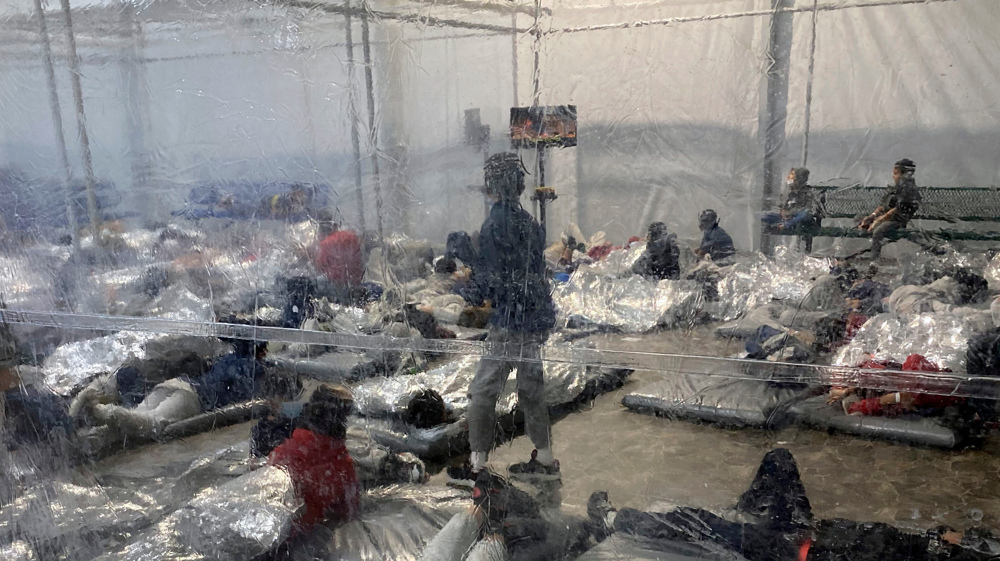 Biden faces mounting criticism as photos show detained migrant children in squalid camps
