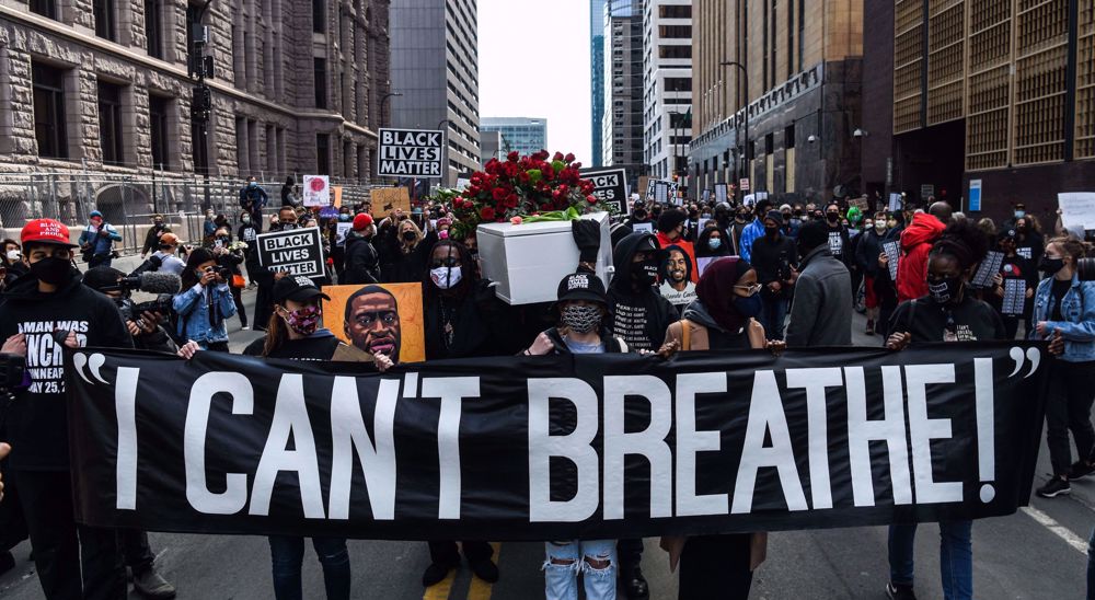 Thousands march in Minneapolis ahead of murder trial in George Floyd’s death