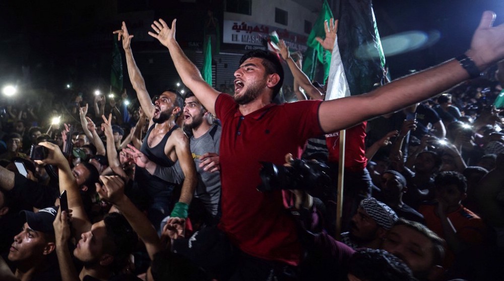 Palestinians celebrate victory, Israelis mourn 'embarrassing' ceasefire 