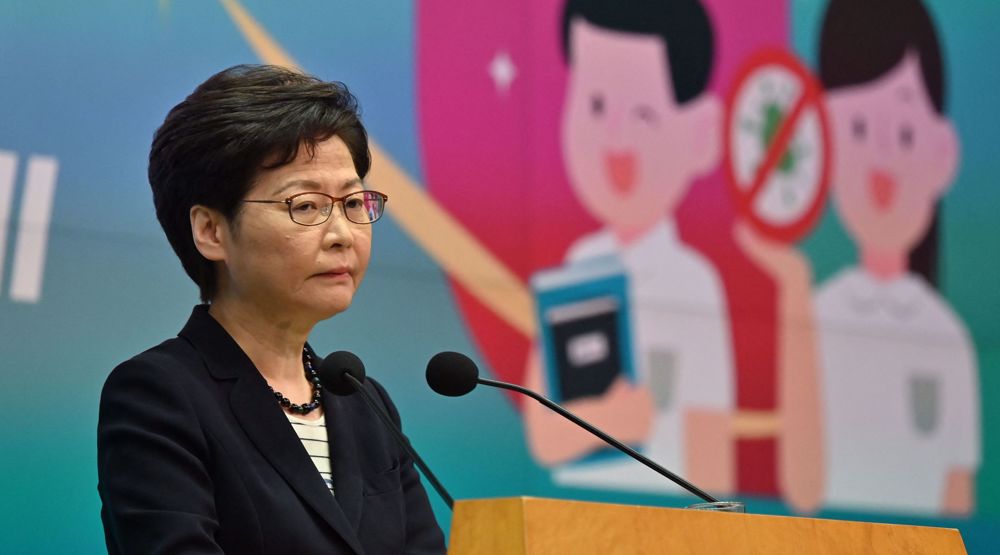 Hong Kong’s leader defends actions against tabloid
