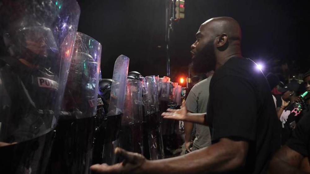 Video showing US police arresting 2 Black men prompts protest