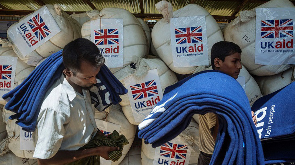 Johnson avoids Tory rebellion over UK aid cutback 