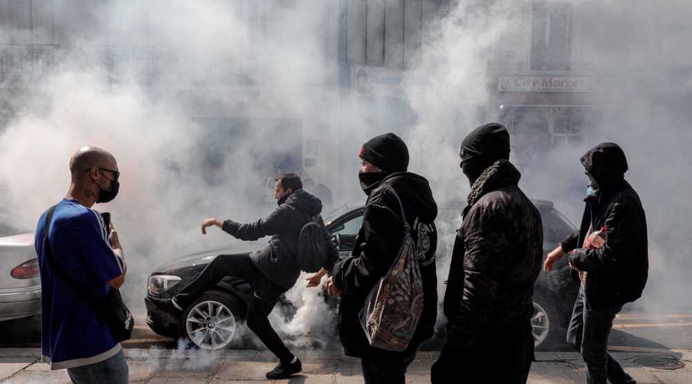 French police fire tear gas as thousands protest new coronavirus rules